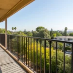 A multi-story apartment building balcony requiring a safety inspection in Santa Ana.