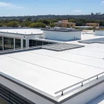 White commercial flat roof installed by a professional roofer in San Diego.