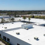 A commercial building with a flat roof, a job for the best commercial roofing companies in California.