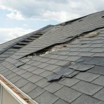 Hail damage on roof shingles requiring a certified inspection.