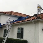 Workers performing an emergency roof leak repair in Southern California.