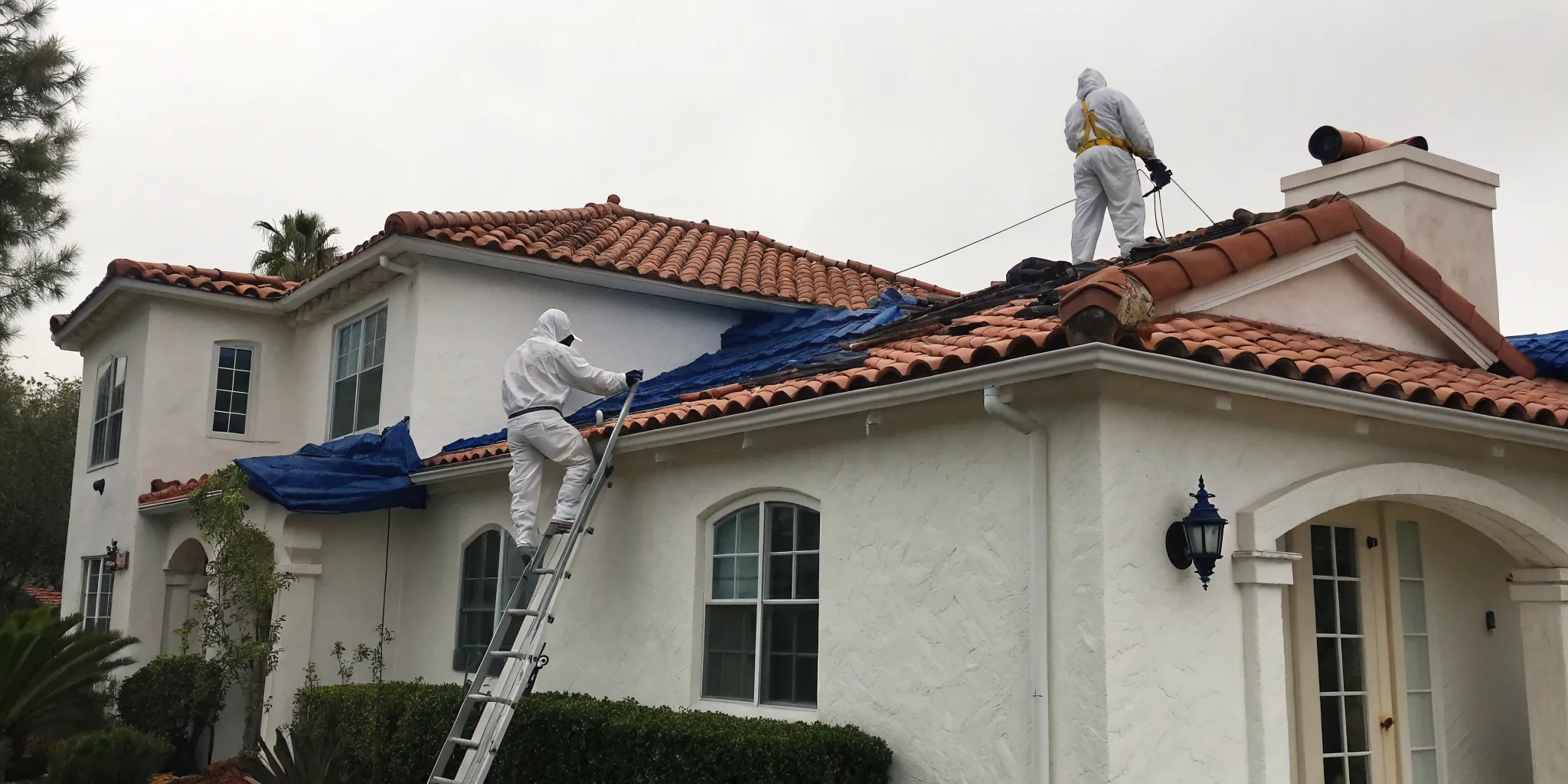 Workers performing an emergency roof leak repair in Southern California.