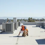 NRCIA-certified inspector performing a commercial roof inspection on a flat roof