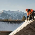 Inspector checking a snow-dusted Western Montana roof