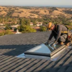 Professional roofer inspecting skylight flashing and seals