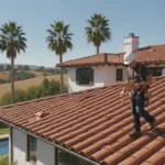 Professional roofer inspecting a residential tile roof in Orange County, California on a sunny spring day