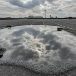 Ponding water on flat roof showing standing water